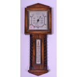 A mid 20th Century oak cased banjo wall barometer having thermometer above flanked by barley twist