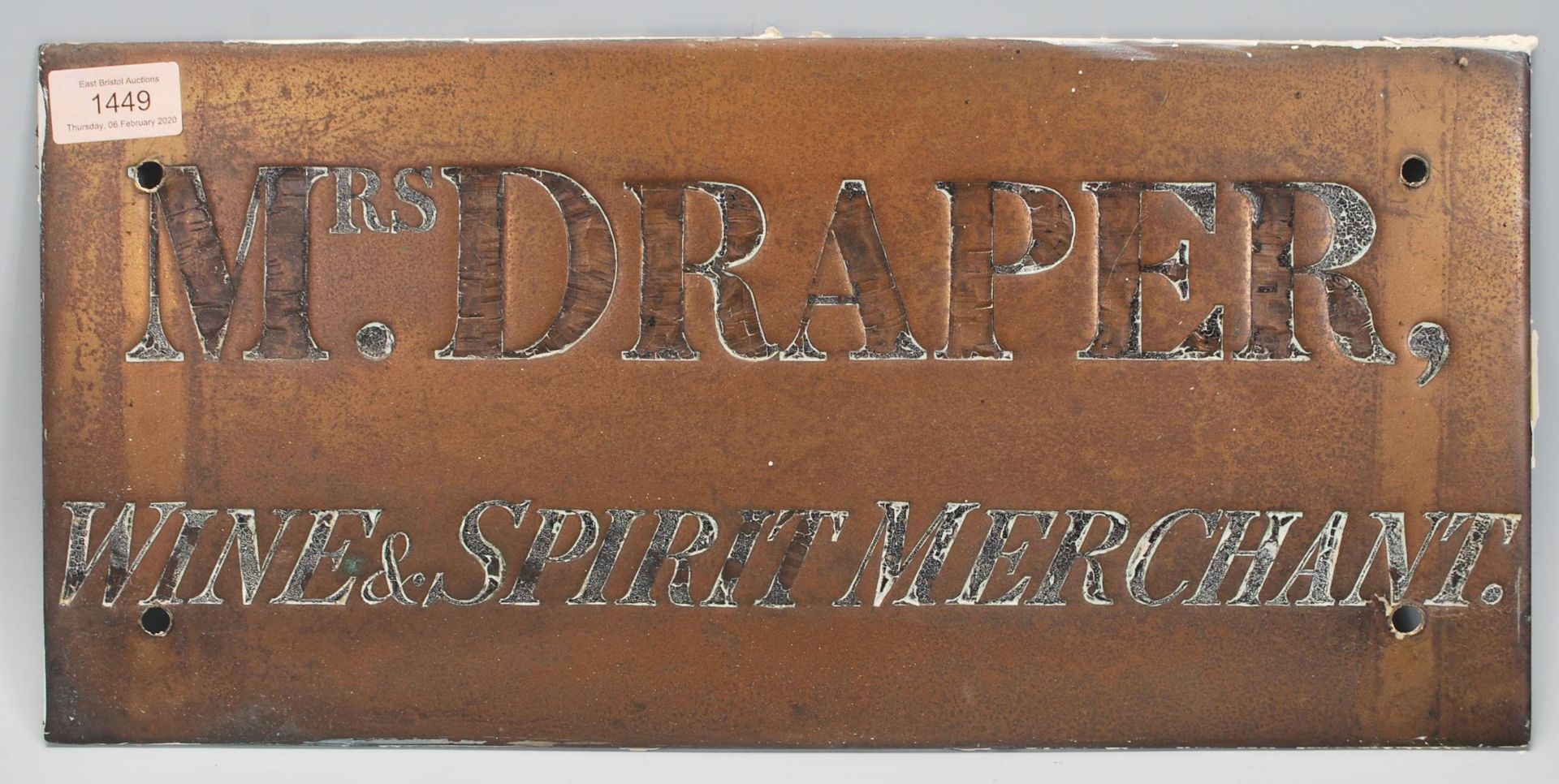 A vintage early 20th Century brass advertising shop sign / plaque engraved  ' Mrs. Draper Wine &