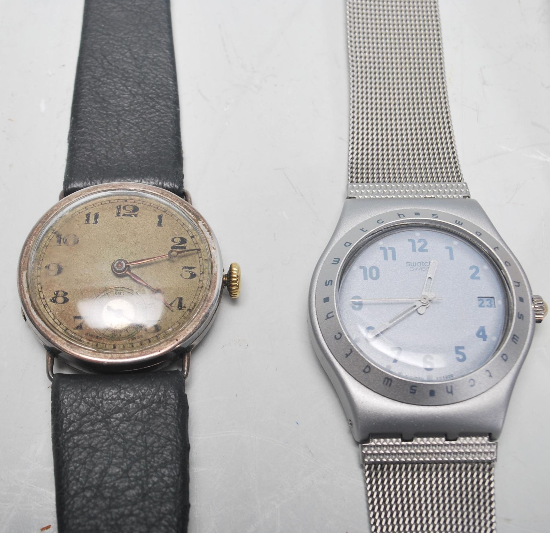 A group of three Swatch watches to include a silver tone bracelet watch, a brown leather strapped - Bild 2 aus 4