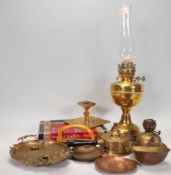 A good collection of 20th century vintage brass items to include an oil lamp, brass oil burners,