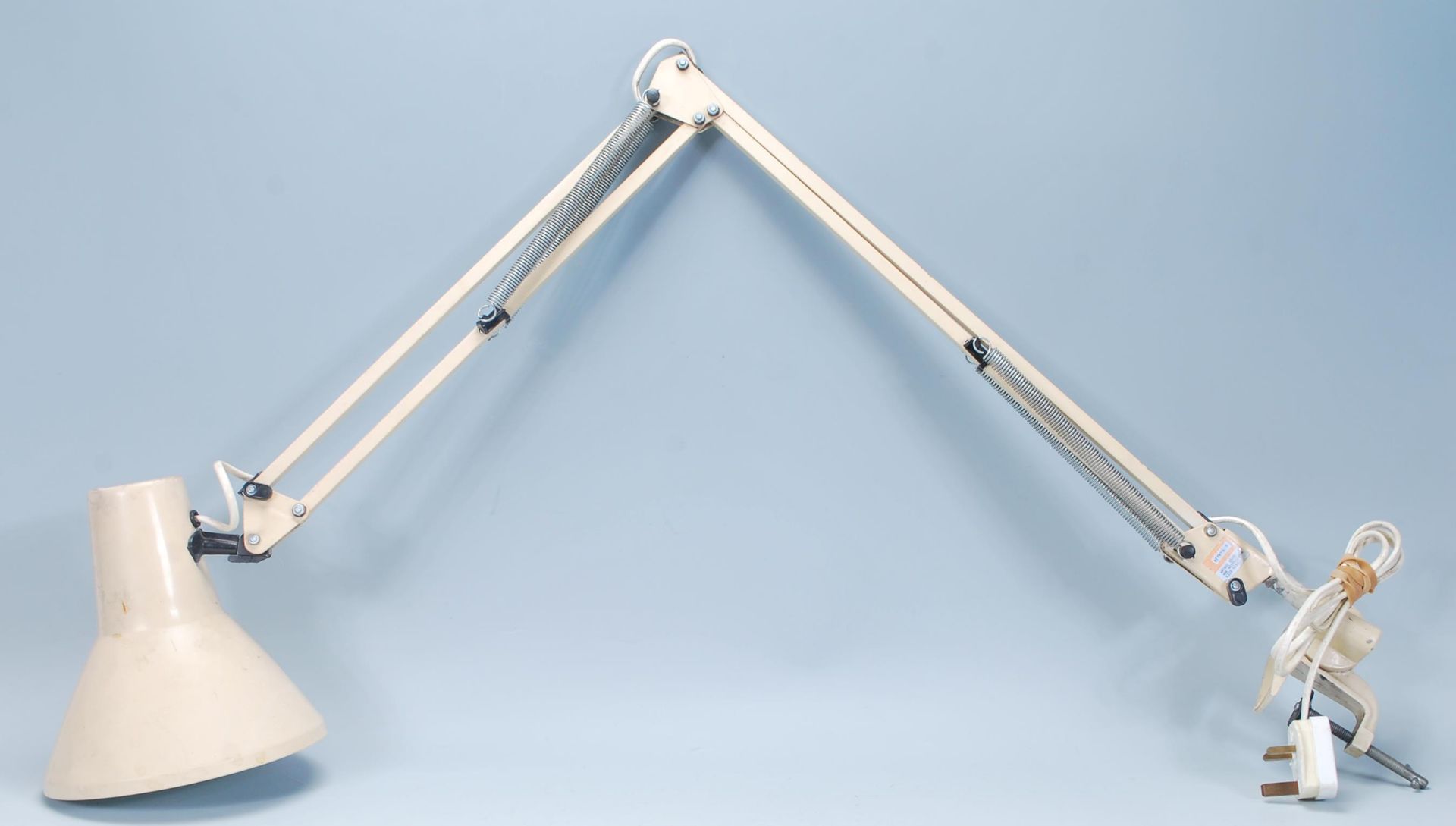A vintage retro 1970's anglepoise desk lamp having a conical shade on a metamorphic posable arm with