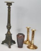 A selection of 20th Century metal ware to include a pair of brass pusher candle sticks, a cast metal