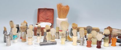 A good collection of vintage 20th Century shaving brushes and other related items to include