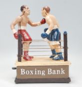 A vintage style cast metal money box ' Boxing Bank ' model with two boxing figures in a ring with