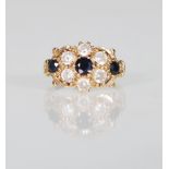 A 9ct gold ladies dress ring having a cluster of white and blue stones. Unmarked. Weight 1.9g.