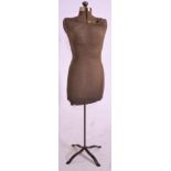 A vintage 20th Century shops display mannequin / tailors dummy, the body upholstered in brown fabric