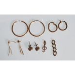 A selection of ladies earrings to include a pair of small hoop earrings (stamped 375), a pair of 9ct