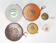 A good selection of mixed tape measures dating from the early 20th Century to include a leather