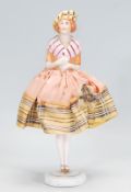 An early 20th Century half doll pin cushion in the form of a Scottish lady with hand painted