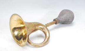 A good early 20th Century vintage brass and rubber side mounted car horn in working order. Measures: