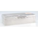 A early 20th Century silver hallmarked cigarette box of rectangular form having curved top to the