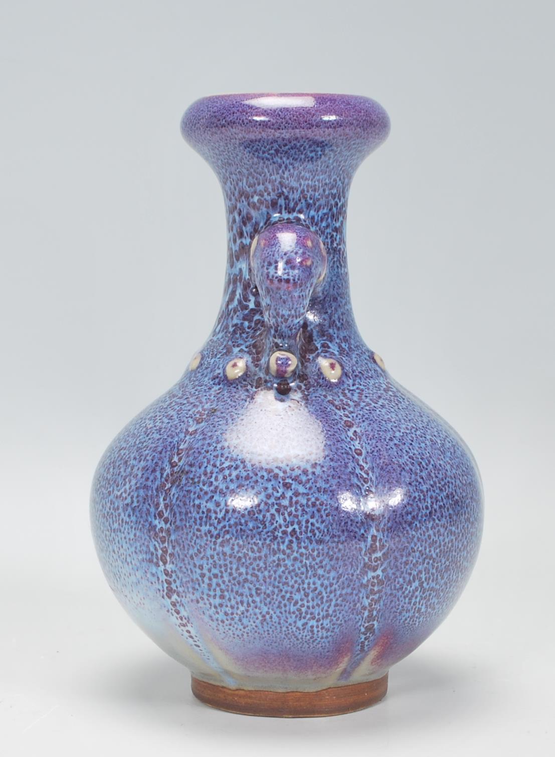 A Chinese earthenware / Jun ware style vase having a bulbous body with tapering neck and twin - Image 2 of 6