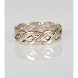 A stamped 375 9ct white gold ring having a pierced twist design. Weight 6.1. Size U.