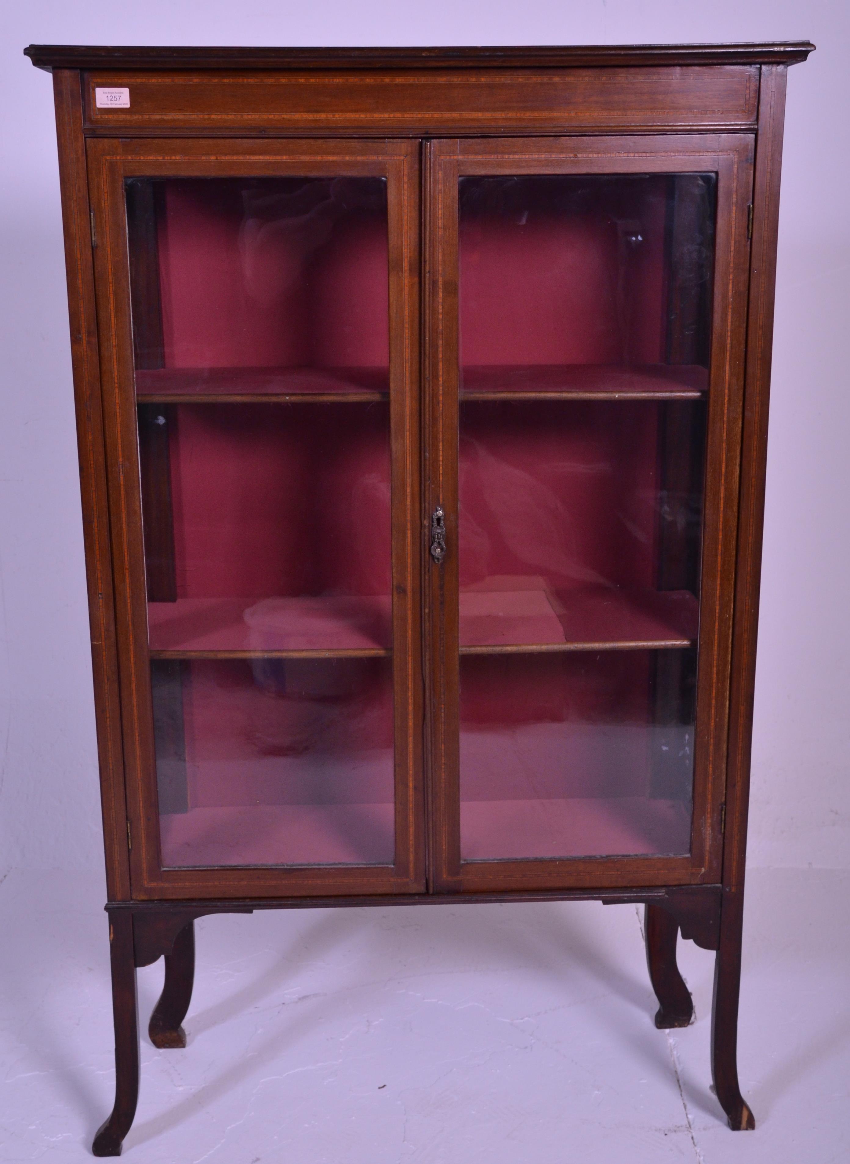 An early 20th Century inlaid mahogany display cabinet / bookcase raised on shaped supports with twin - Image 2 of 6