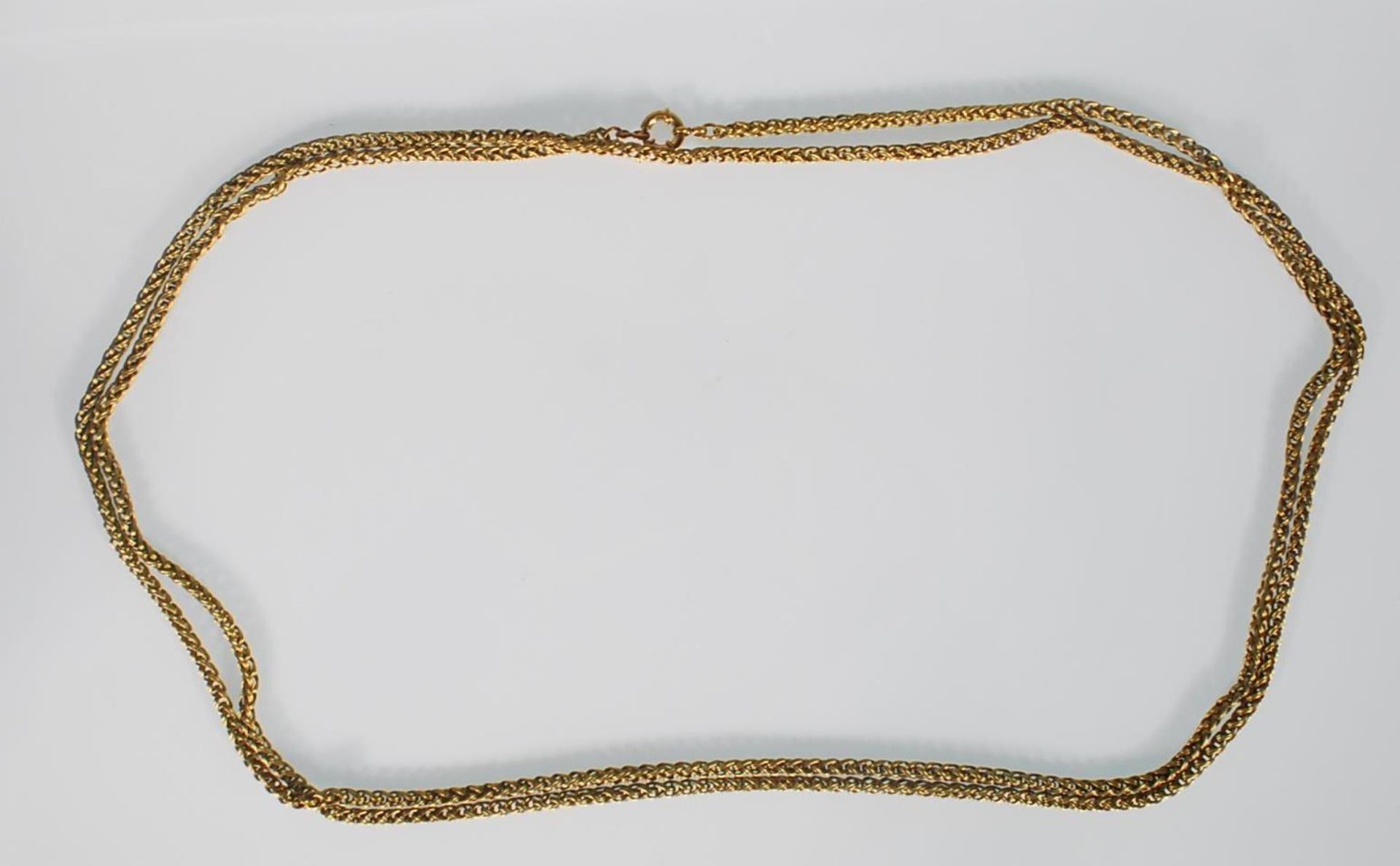 A 20th Century brass guard watch chain with woven links and a spring ring clasp. Measures: 62