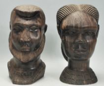 A pair of 20th Century African carved hardwood figurines / statues in the form of busts of a man and