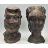 A pair of 20th Century African carved hardwood figurines / statues in the form of busts of a man and