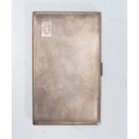 A large mid 20th Century English silver cigarette case of rectangular form having engine turned body