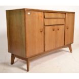 A vintage mid 20th Century 1960's 1970's beech wood sideboard having two angular beehive drawers