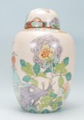 A 20th century Chinese ginger jar decorated in an Art Deco taste with kingfisher, butterfly and