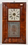 An early 20th Century American walnut wood wall clock of rectangular form having a square face to
