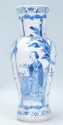 A 19th Century Chinese vase of baluster form having a waisted body hand painted in blue and white