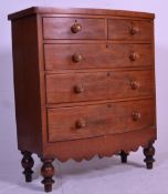A 19th Century mahogany chest of drawers raised on turned supports consisting of two short over