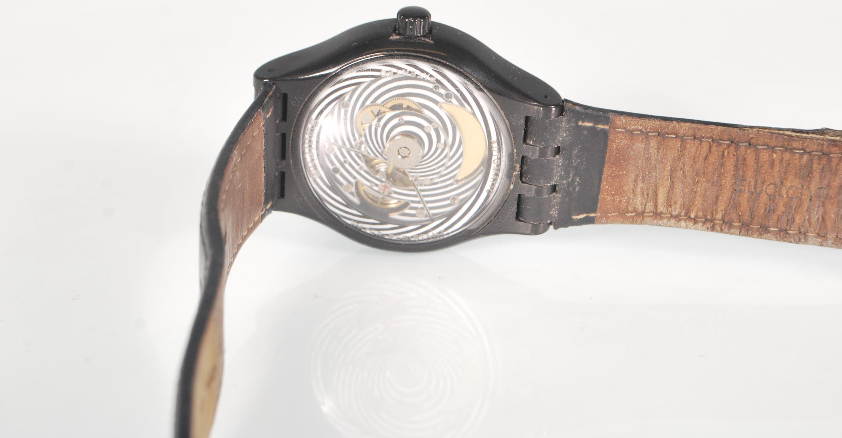 A Swatch Swiss Automatic wrist watch having a black face with a satellite design dial and date - Image 4 of 4