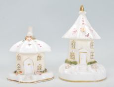 A pair of 19th Century Staffordshire ceramic pastille burner style fairy light / tea light holders