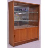 A vintage retro mid 20th Century teak wood display drinks cabinet / bookshelf having two glass