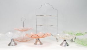 A good group of early 20th Century Art Deco cake stands of varying sizes and colours to include four