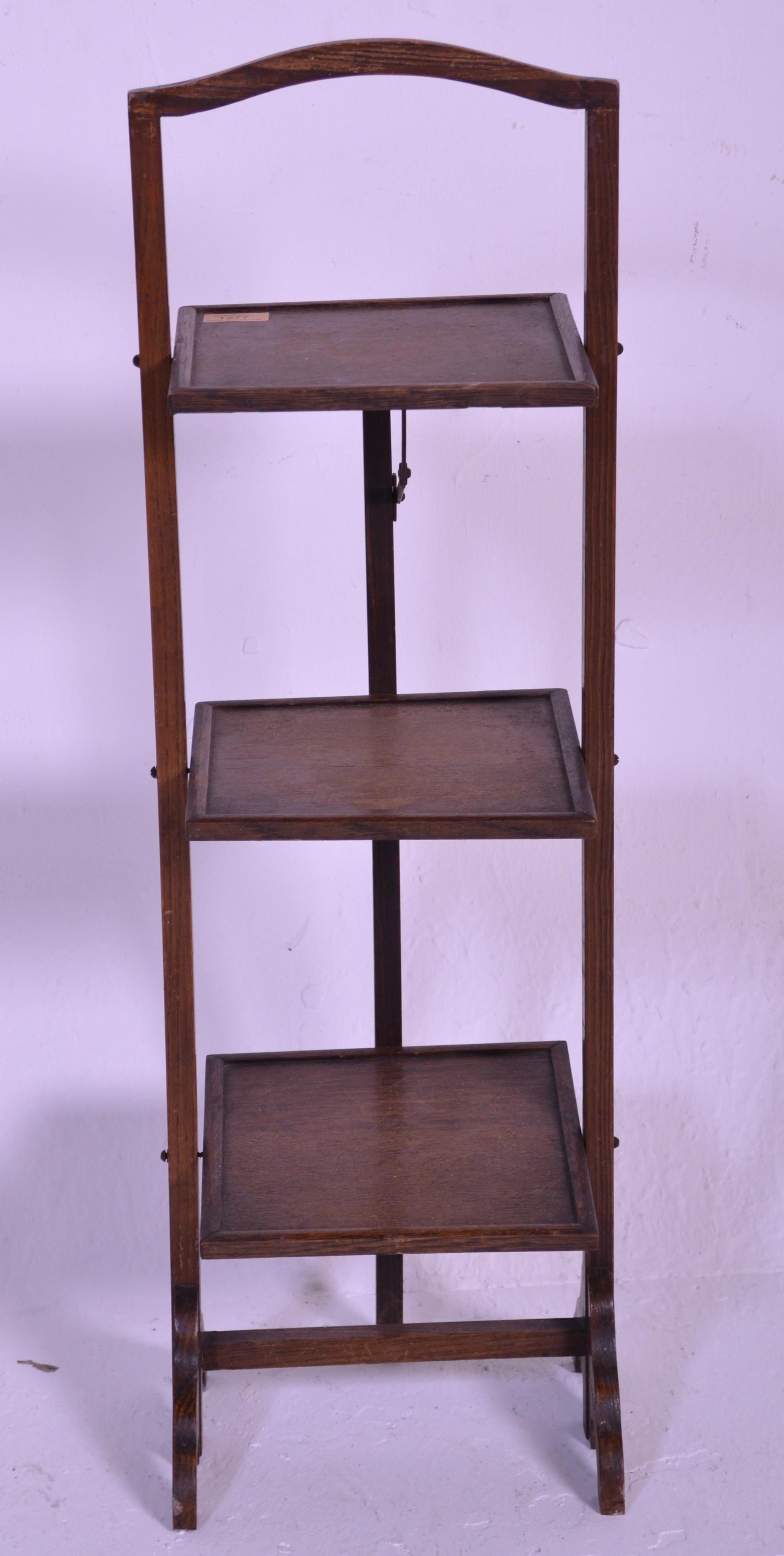 A vintage early 20th Century 1930's oak three tier folding cake stand of square form raised on - Image 2 of 4