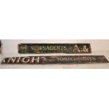 A vintage early to mid 20th Century wooden shop advertising sign having an ebonised ground with