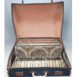 A vintage mid Century Settimio Soprani piano accordion having celluloid keys with a geometric inlaid