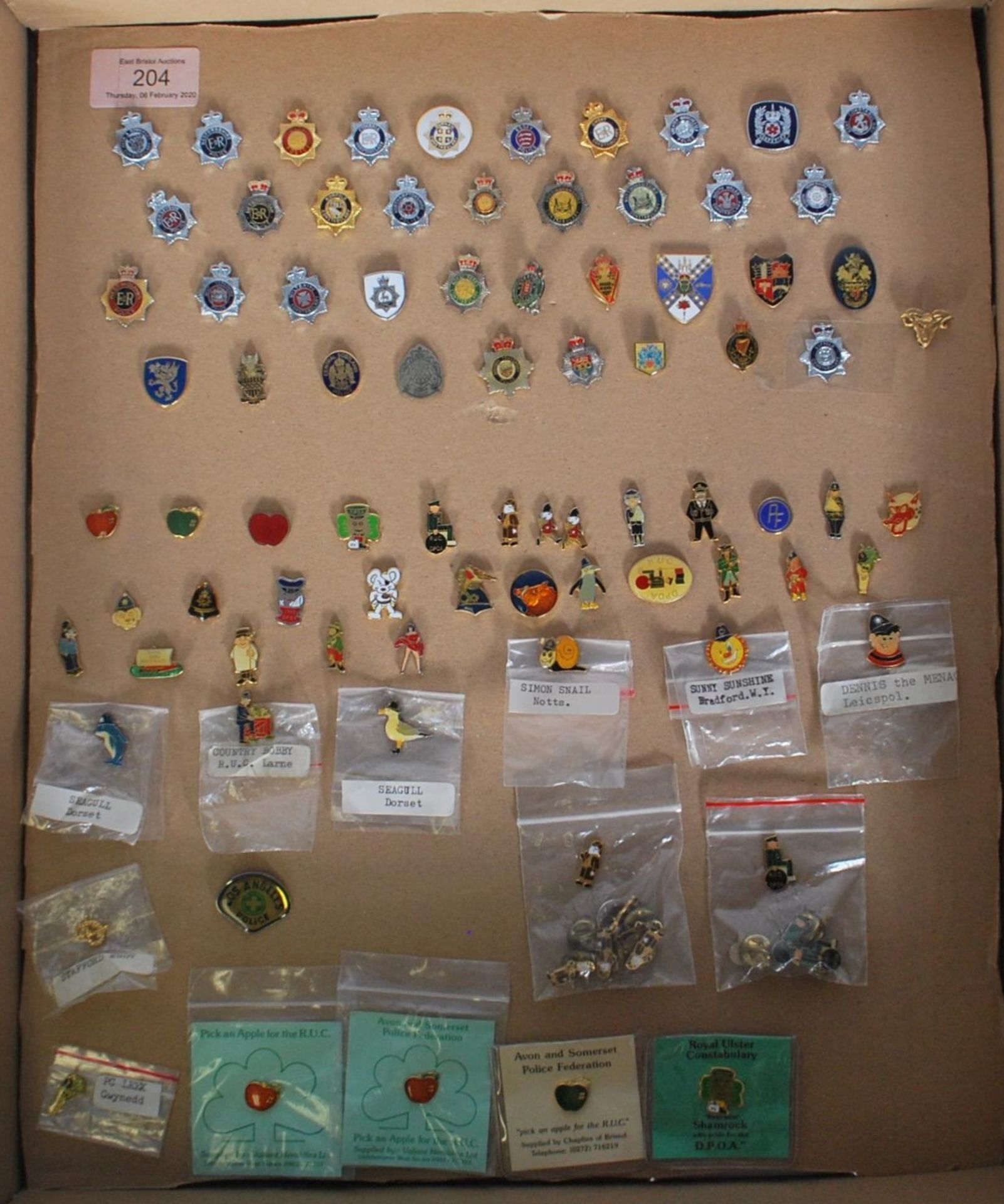 A collection of 20th Century vintage police related enamelled pin badges to include a selection of