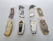 A group of seven Franklin Mint Collectors Knives. The knives include Dracula, a wolf example,