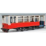 A large vintage 20th Century scratch built model of a tram with painted features.  Measures 24 cm