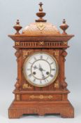 A Victorian 19th century oak mantel / bracket clock with oak case having pediment top with inset