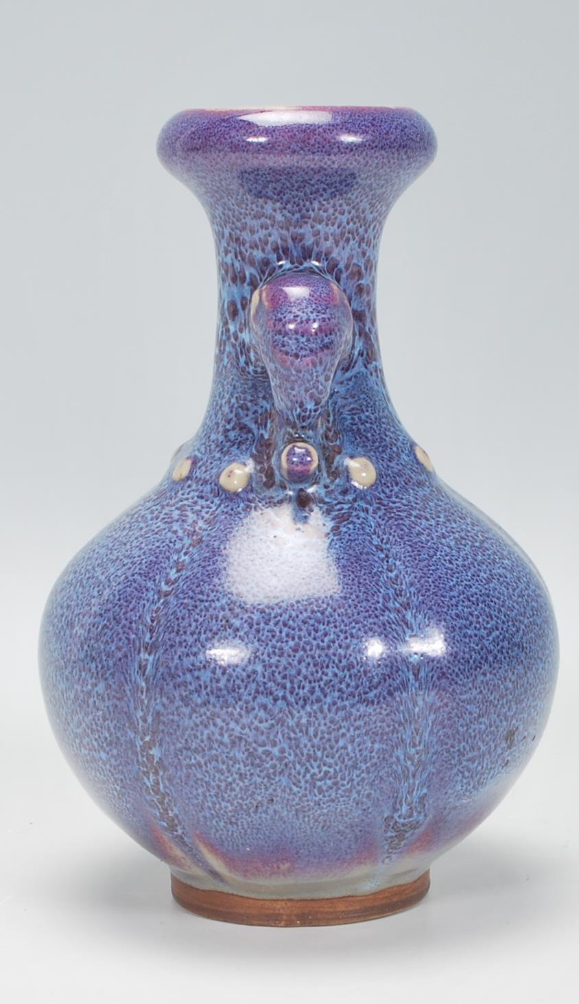 A Chinese earthenware / Jun ware style vase having a bulbous body with tapering neck and twin - Image 4 of 6