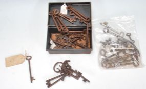 A good collection of decorative antique keys of various sizes and forms, some railway related
