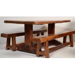 A large contemporary African hardwood dining table and benches. The benches raised on straight leg