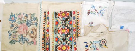 A collection of 20th century hand embroidered linens to include a selection of floral embroidered