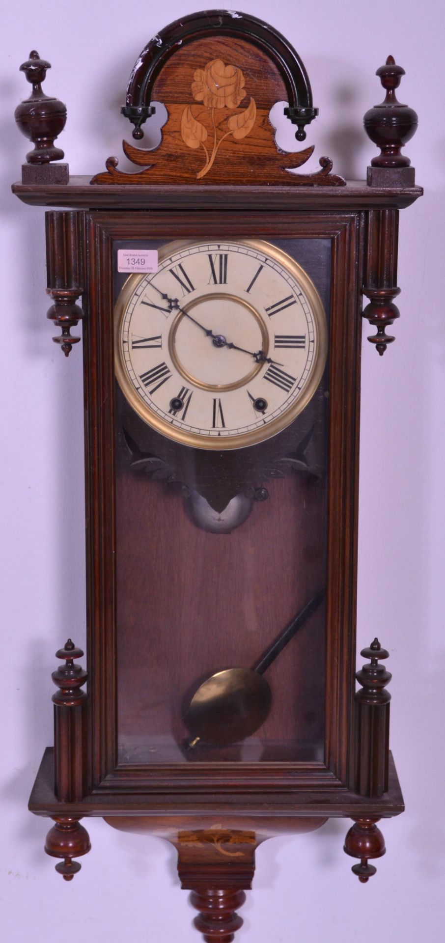 An early 20th century mahogany cased Vienna regulator wall clock complete with pendulum and
