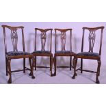 A set of four Edwardian mahogany Queen Anne style high back dining chairs raised on cabriole legs