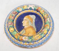 A Renaissance style majolica wall mounting plaque of round form having raised fruit garland