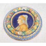 A Renaissance style majolica wall mounting plaque of round form having raised fruit garland