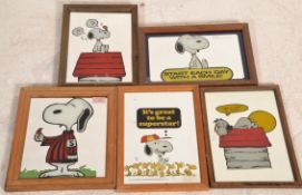 A group of five vintage 20th Century novelty Peanuts character Snoopy mirrors with some bearing