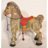 A vintage retro mid 20th Century 1950's toy ride along horse complete with blue and red coloured