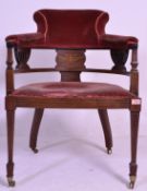 An Edwardian mahogany inlaid salon tub armchair. Raised on square tapering legs with spade feet