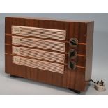 A vintage mid 20th Century walnut cased Ecko radio having cream bakelite cover to the front with